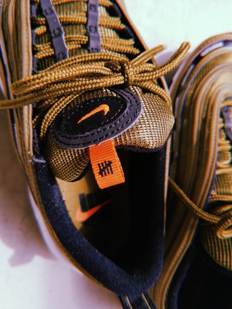 Undefeated x AM97_SNKRGIRL_logo